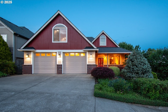 2002 35th St, Washougal, WA 98671 - view of front of house featuring concrete driveway, brick siding, and an attached garage