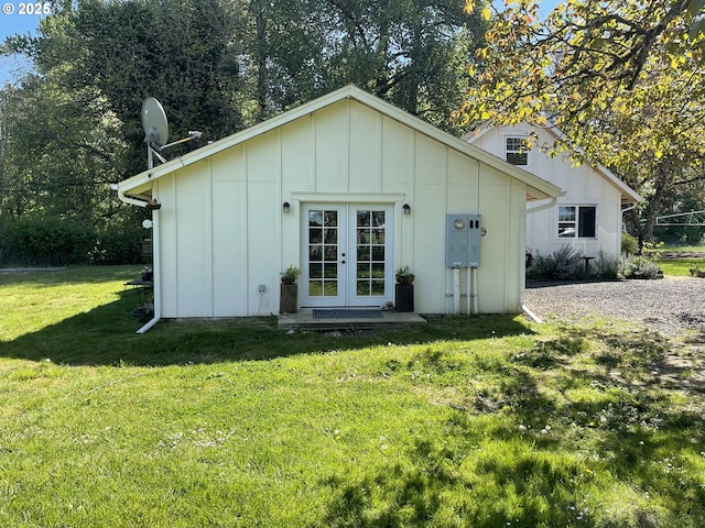 24291 SW Rogers Rd, Sheridan, OR 97378 - rear view of property featuring board and batten siding, french doors, and a yard