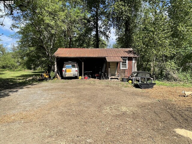 24291 SW Rogers Rd, Sheridan, OR 97378 - view of outbuilding with a carport and driveway