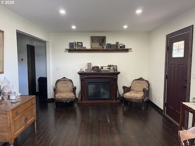 24291 SW Rogers Rd, Sheridan, OR 97378 - living area featuring hardwood / wood-style flooring, a glass covered fireplace, recessed lighting, and baseboards