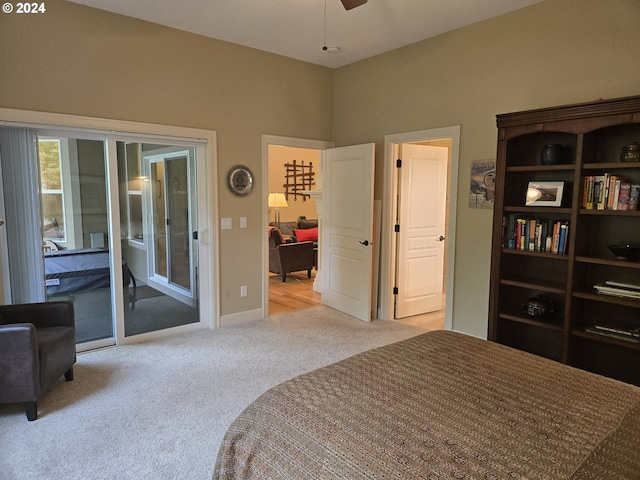 899 NW Angel Heights Rd, Stevenson, WA 98648 - bedroom with access to exterior, carpet floors, and baseboards