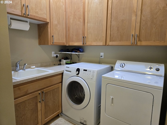 899 NW Angel Heights Rd, Stevenson, WA 98648 - laundry room with washing machine and clothes dryer and cabinet space