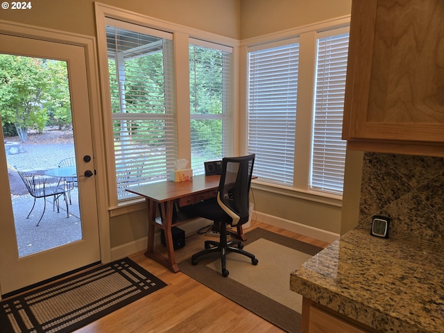 899 NW Angel Heights Rd, Stevenson, WA 98648 - office space with light wood-style flooring, healthy amount of natural light, and baseboards
