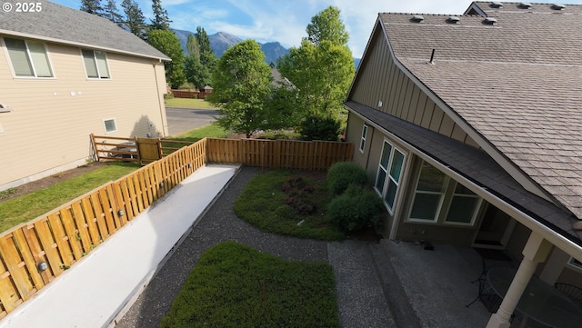 899 NW Angel Heights Rd, Stevenson, WA 98648 - fenced backyard with a mountain view and a patio area