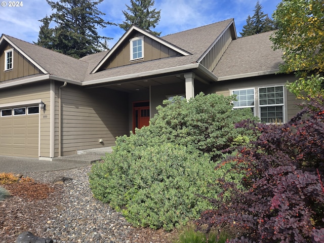 899 NW Angel Heights Rd, Stevenson, WA 98648 - craftsman house with board and batten siding, roof with shingles, and a garage