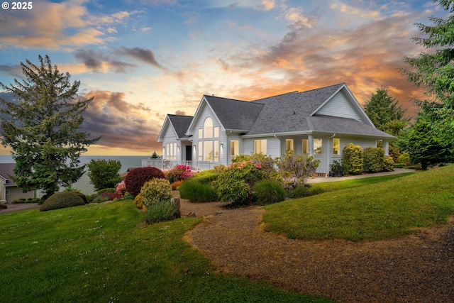 90955 Southview Ln, Florence, OR 97439 - view of front of home featuring a lawn and a shingled roof