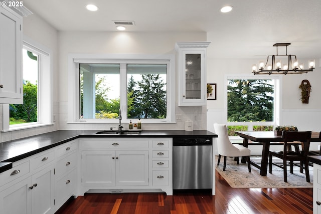 90955 Southview Ln, Florence, OR 97439 - kitchen featuring dishwasher, a sink, dark countertops, plenty of natural light, and recessed lighting