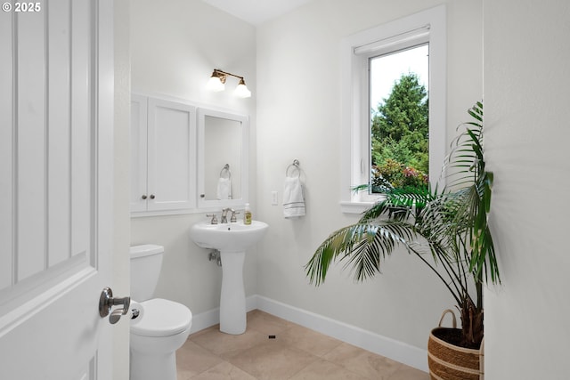 90955 Southview Ln, Florence, OR 97439 - bathroom with toilet, tile patterned flooring, and a sink