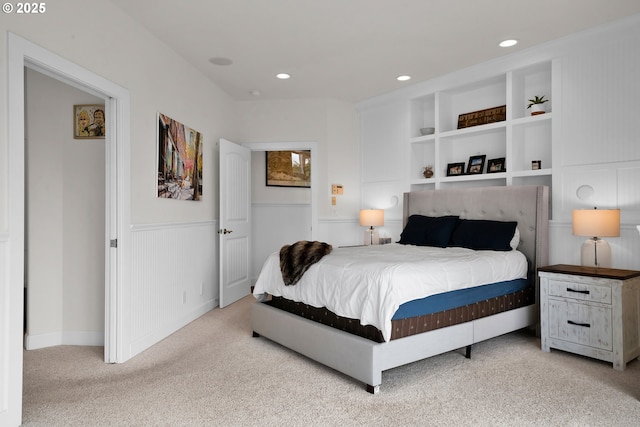 90955 Southview Ln, Florence, OR 97439 - bedroom with wainscoting, light carpet, and recessed lighting