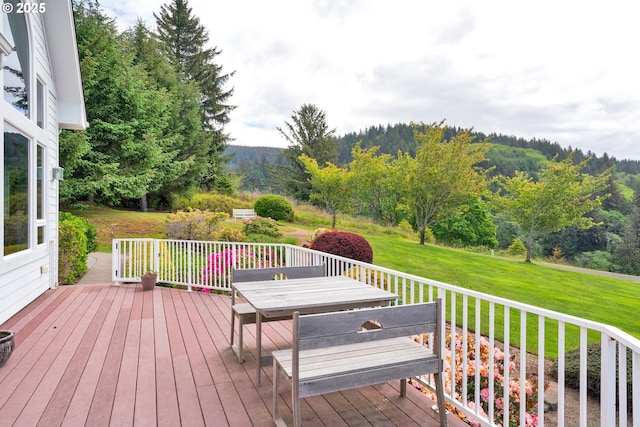 90955 Southview Ln, Florence, OR 97439 - wooden deck featuring a lawn, outdoor dining area, and a mountain view
