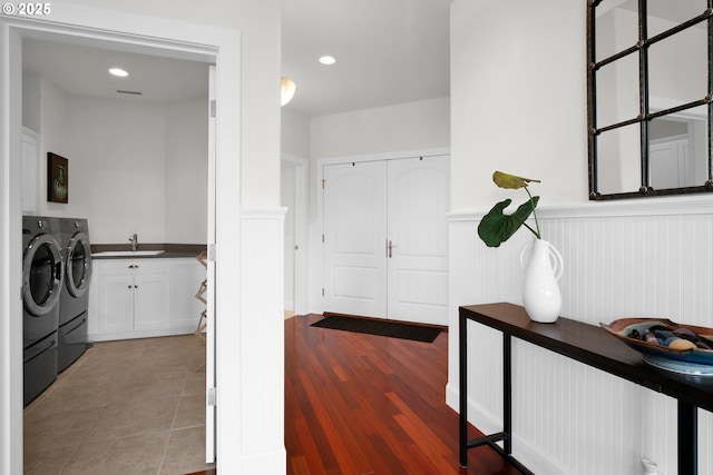 90955 Southview Ln, Florence, OR 97439 - washroom with cabinet space, independent washer and dryer, a wainscoted wall, light wood-style floors, and recessed lighting