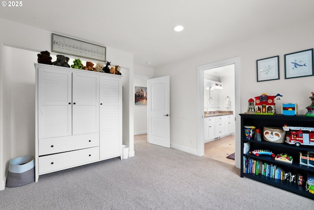 90955 Southview Ln, Florence, OR 97439 - bedroom with carpet floors, recessed lighting, ensuite bath, and baseboards