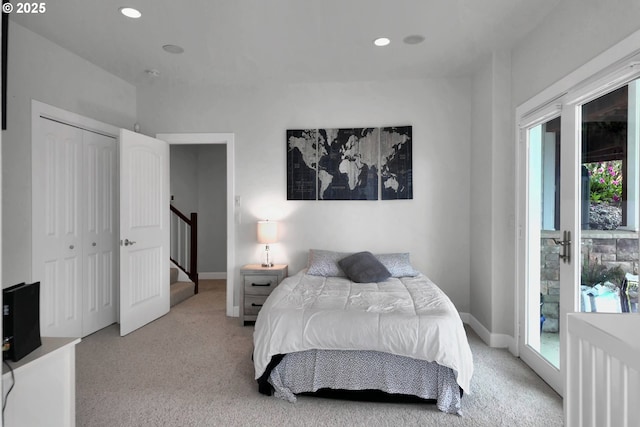 90955 Southview Ln, Florence, OR 97439 - bedroom with light colored carpet, access to outside, multiple windows, and recessed lighting