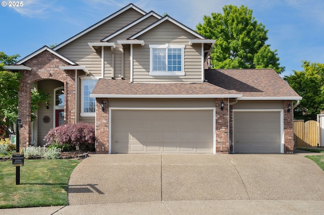view of front of house featuring brick siding, driveway, a garage, and roof with shingles