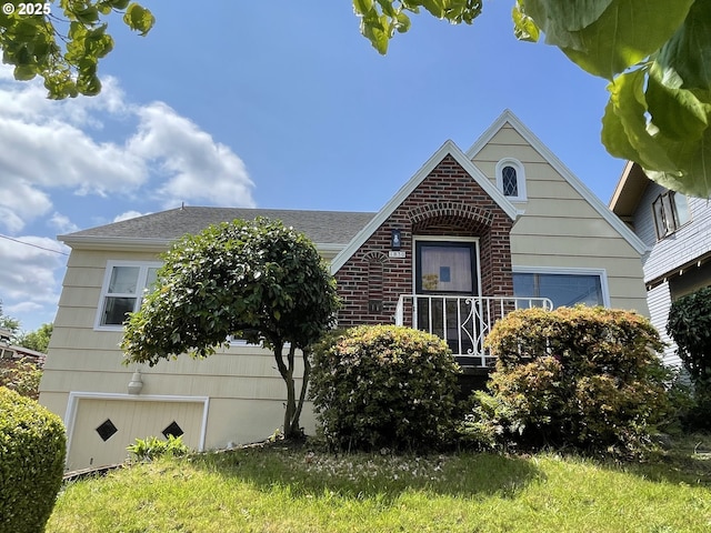 1830 N Winchell St, Portland, OR 97217 - view of front of house featuring brick siding and a shingled roof