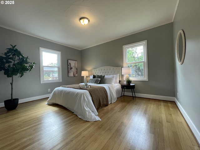 1830 N Winchell St, Portland, OR 97217 - bedroom featuring crown molding, multiple windows, wood-type flooring, and baseboards