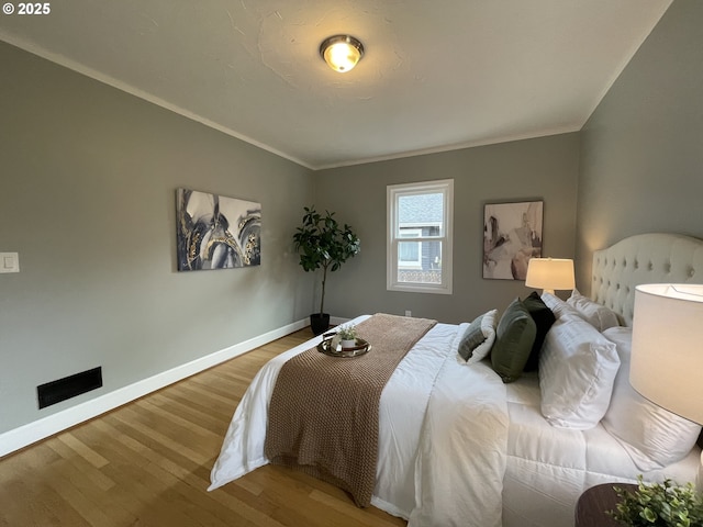 1830 N Winchell St, Portland, OR 97217 - bedroom featuring wood finished floors, baseboards, and ornamental molding