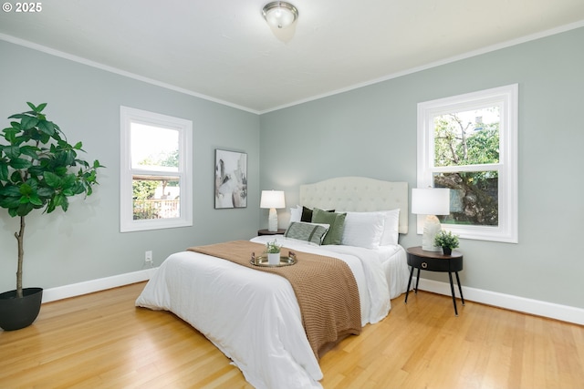 1830 N Winchell St, Portland, OR 97217 - bedroom featuring wood finished floors, multiple windows, and ornamental molding