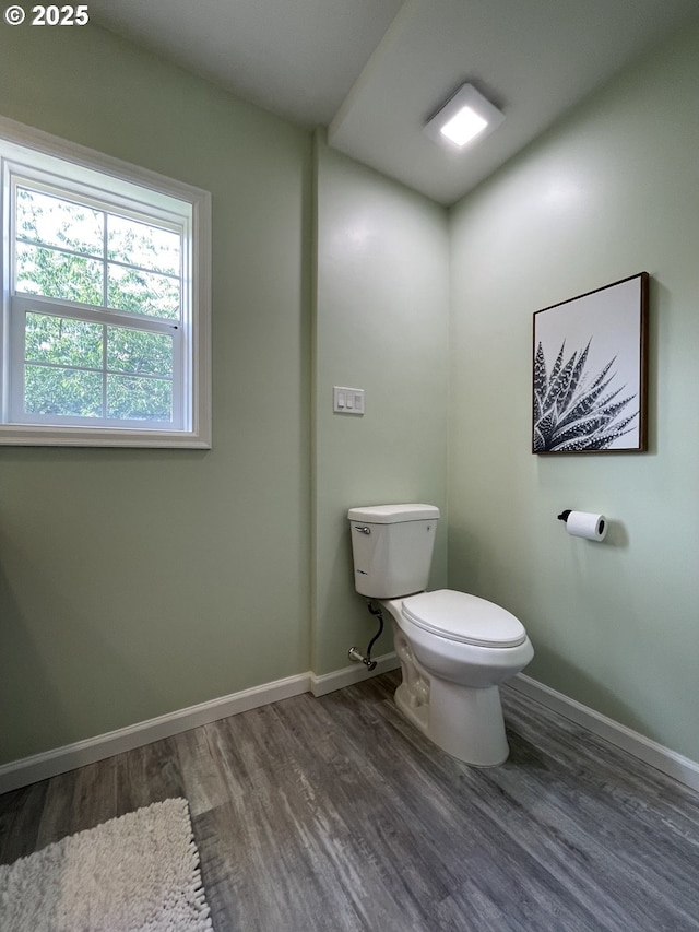 1830 N Winchell St, Portland, OR 97217 - half bath featuring wood finished floors, toilet, and baseboards