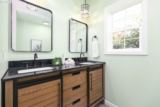 1830 N Winchell St, Portland, OR 97217 - full bathroom with double vanity and baseboards