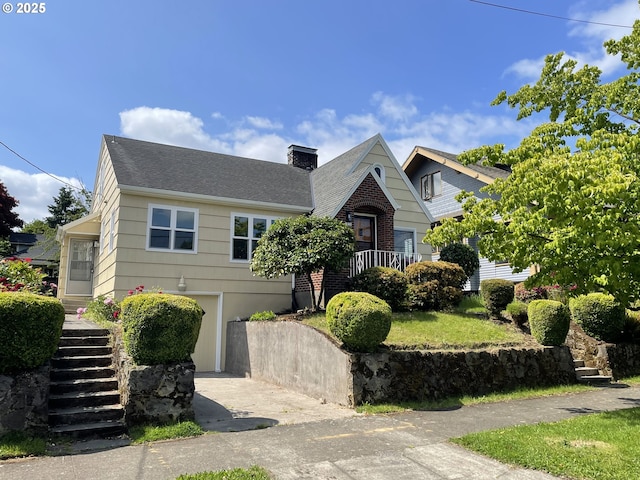1830 N Winchell St, Portland, OR 97217 - view of front facade with stairs, a chimney, a shingled roof, and brick siding