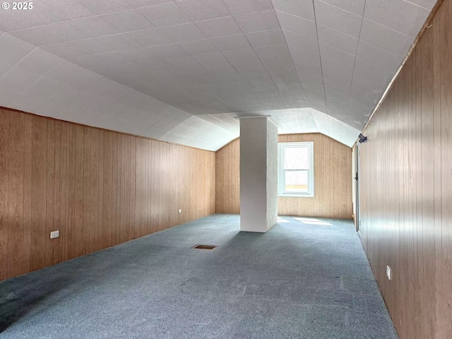 1830 N Winchell St, Portland, OR 97217 - additional living space with carpet flooring, vaulted ceiling, and wooden walls