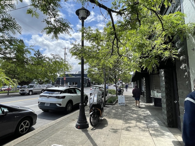 1830 N Winchell St, Portland, OR 97217 - view of asphalt road featuring sidewalks, street lights, and curbs