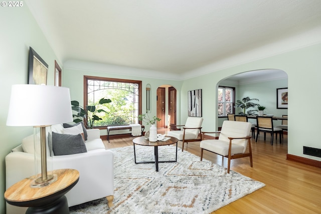 1830 N Winchell St, Portland, OR 97217 - living area with arched walkways and wood finished floors