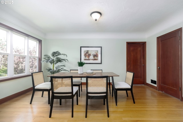 1830 N Winchell St, Portland, OR 97217 - dining room with light wood-style flooring and baseboards