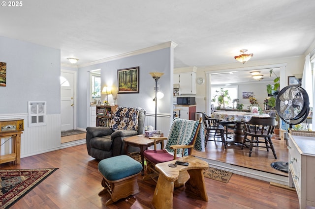 4635 Daisy St, Springfield, OR 97478 - living room featuring crown molding, wood finished floors, and a wainscoted wall