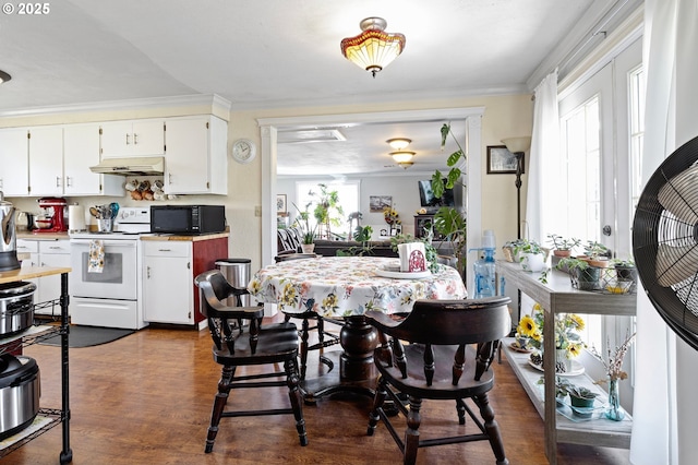 4635 Daisy St, Springfield, OR 97478 - dining room with ornamental molding and dark wood-type flooring
