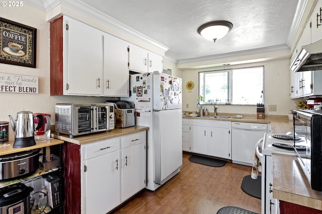 4635 Daisy St, Springfield, OR 97478 - kitchen with white appliances, ornamental molding, light countertops, a textured ceiling, and white cabinetry