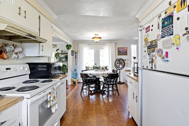 4635 Daisy St, Springfield, OR 97478 - kitchen with white appliances, crown molding, dark wood-style flooring, light countertops, and white cabinets