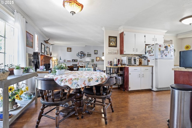 4635 Daisy St, Springfield, OR 97478 - dining room featuring ornamental molding and dark wood-style flooring