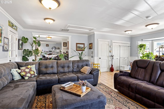 4635 Daisy St, Springfield, OR 97478 - living room with a wainscoted wall, ornamental molding, and light wood-style flooring