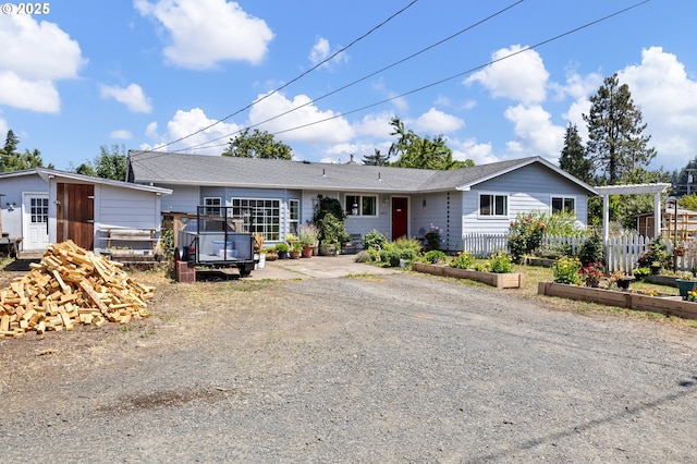 4635 Daisy St, Springfield, OR 97478 - ranch-style home featuring a vegetable garden