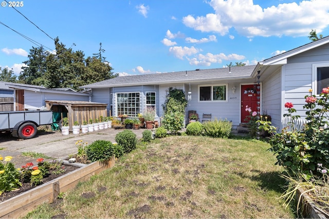 4635 Daisy St, Springfield, OR 97478 - view of front of property featuring a vegetable garden and a front yard
