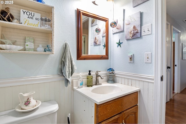 4635 Daisy St, Springfield, OR 97478 - bathroom featuring a wainscoted wall, vanity, and wood finished floors