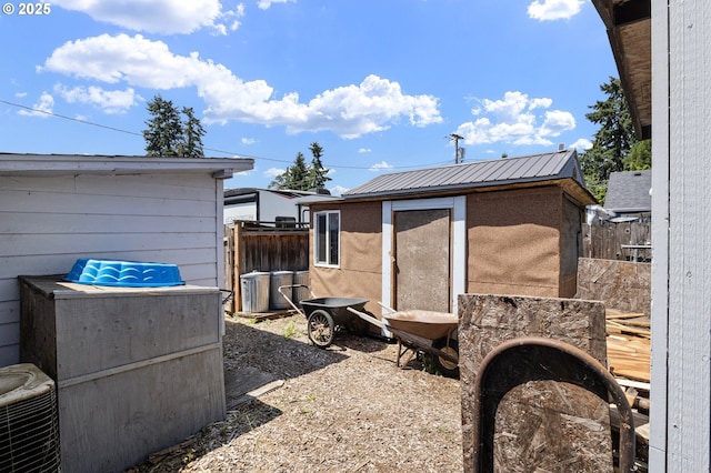 4635 Daisy St, Springfield, OR 97478 - view of property exterior featuring a metal roof and a storage unit