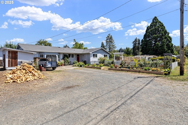 4635 Daisy St, Springfield, OR 97478 - ranch-style house featuring a garden and driveway