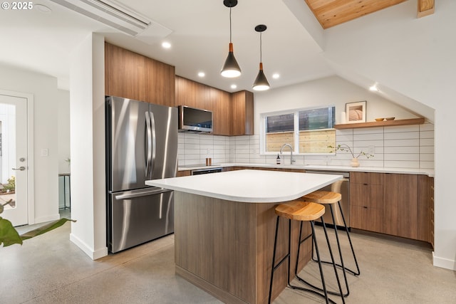 kitchen with a sink, modern cabinets, brown cabinets, and stainless steel appliances