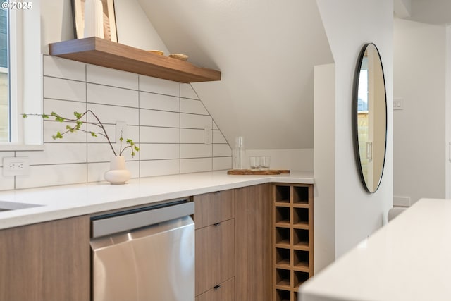 kitchen with modern cabinets, open shelves, tasteful backsplash, stainless steel dishwasher, and brown cabinetry