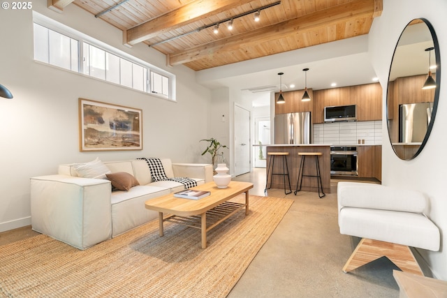 living room with beamed ceiling, rail lighting, wood ceiling, and recessed lighting