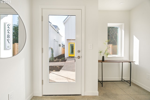 entryway featuring baseboards