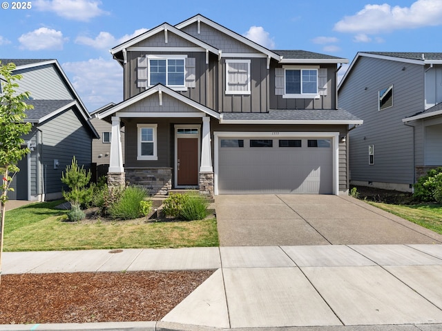 1555 Nolan Ave SE, Albany, OR 97322 - craftsman-style house featuring driveway, board and batten siding, a garage, a porch, and stone siding