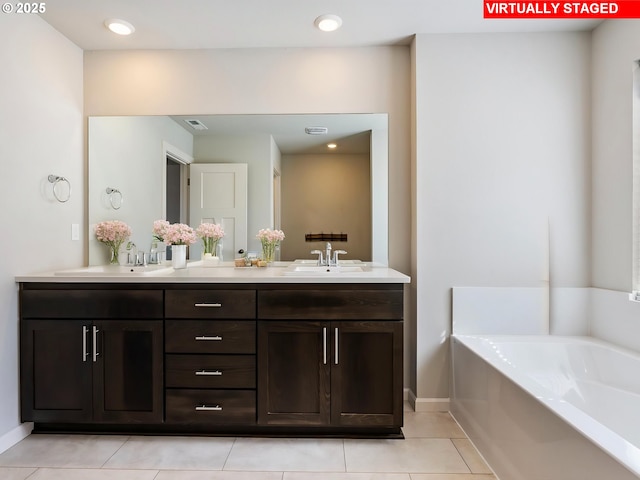 1555 Nolan Ave SE, Albany, OR 97322 - bathroom with double vanity, a garden tub, and tile patterned floors