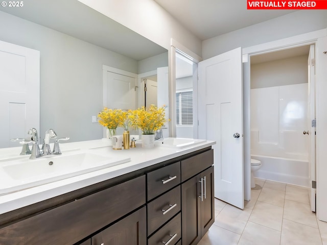 1555 Nolan Ave SE, Albany, OR 97322 - bathroom featuring double vanity, toilet, and tile patterned flooring