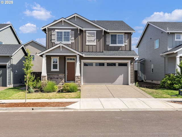 1555 Nolan Ave SE, Albany, OR 97322 - craftsman-style house featuring board and batten siding, driveway, a garage, and roof with shingles
