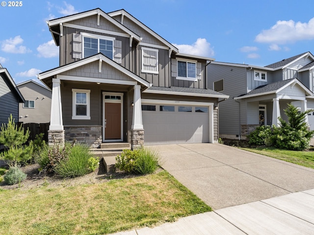 1555 Nolan Ave SE, Albany, OR 97322 - craftsman house with an attached garage, driveway, stone siding, board and batten siding, and a front yard