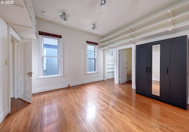 unfurnished bedroom with wood-type flooring